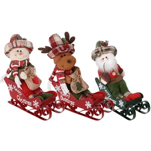 Three Christmas figurines of Santa, reindeer and snowman on metal sledges for home decor