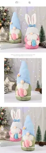 Detail of handmade Easter gnomes with rabbit ears holding colorful festive eggs