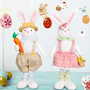 Easter bunny plush figurines with carrot and basket on blue wooden floor display