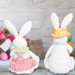 Detail of plush Easter bunnies with DIY wooden sign and carrot in cozy home setting