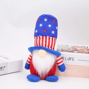 Patriotic July 4th gnome plush with stars and stripes hat on a clean white background