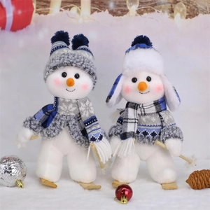 Blue fabric Christmas snowman plush set with skis and knit accessories for holiday decor
