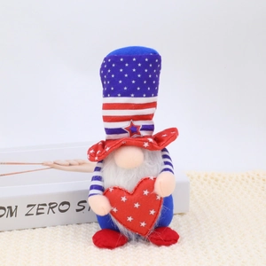 Detail of 4th of July patriotic gnome plush holding a red star heart with striped hat