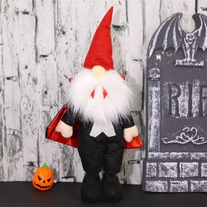 Standing Halloween vampire gnome plush with red pointed hat and cape in spooky scene