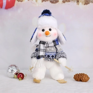 Detail of plush Christmas snowman figurine with ski poles and blue knit earflap hat