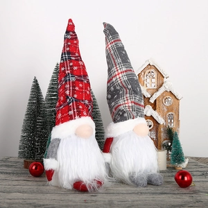 Set of two glowing Christmas gnomes with plaid hats and snowflakes for home decor