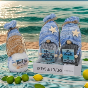 Three nautical beach gnomes with striped hats and signs like Life is Better at the Beach