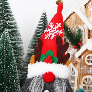 Christmas gnome doll with reindeer antlers and red hat for festive home decoration