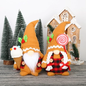 Detail of gingerbread themed Christmas gnomes with plaid aprons and festive accessories