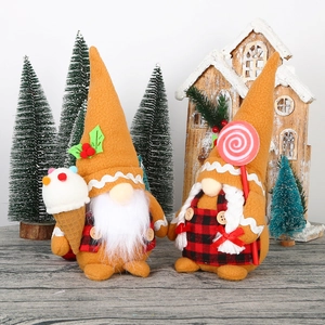 Set of two gingerbread Christmas gnomes in festive plaid outfits and yellow pointed hats