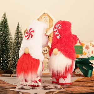 Pair of Christmas Gnomes with candy-themed hats and long beards on festive background