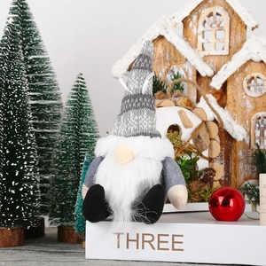 Charming Christmas forest gnome plush doll with a striped knit hat for festive tree decor