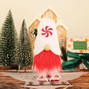 Standing red and white Christmas Gnome with candy cane hat and festive gift decor