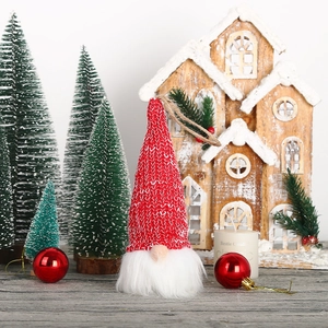 Knitted Christmas gnome ornament with red and white hat and plush beard for holiday decor