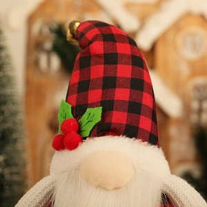 Lighted Christmas gnome plush in red buffalo plaid with bell and holly decoration