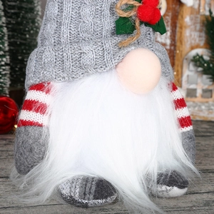 Detailed view of Christmas gnome with glowing hat and plush white beard decorations