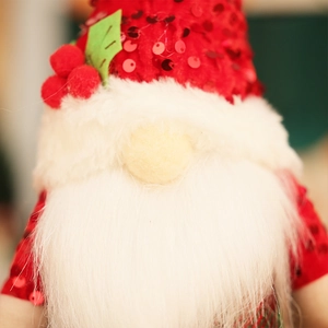 Sparkly red sequin Christmas gnome plush with white beard and festive holly berry hat