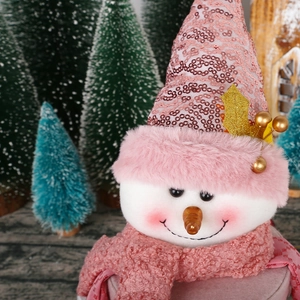 Pink plush snowman Christmas ornament with sequin hat and scarf for festive decoration