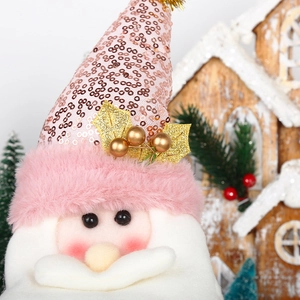 Detail of pink sequin Santa Claus doll with fluffy beard for Christmas decoration