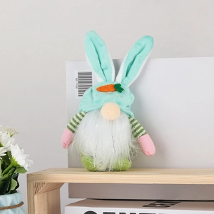 Detail of Easter gnome plush with bunny ears, carrot accents, and soft white beard decor