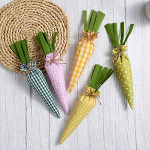 Easter fabric carrot ornaments set with plaid patterns on a rustic wood background