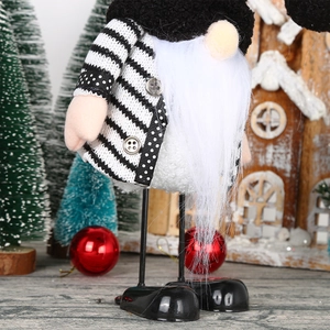 Detail of wedding gnome plush with striped sweater and long white beard on festive background