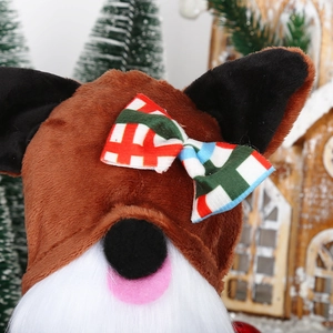 Detail of Christmas gnome plush toy with plaid bow and soft white beard decoration