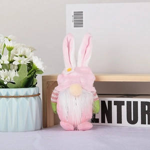 Close-up of a pink plush Easter bunny gnome doll with long ears and white beard