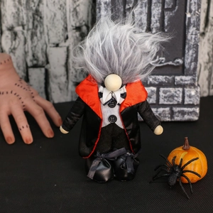 Detailed vampire gnome plush with grey hair and black cape for Halloween decor