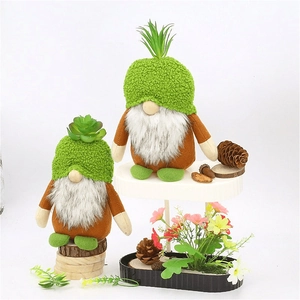 Set of two green Christmas forest gnomes with plush hats and white beards on white stand
