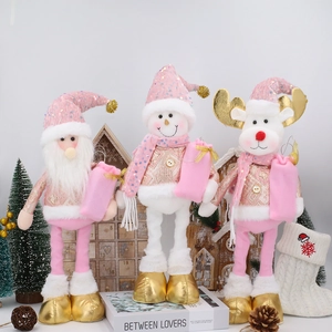 Pink and gold Christmas plush dolls set featuring Santa, snowman and reindeer figures
