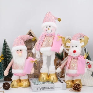 Pink and gold telescopic Christmas figurines featuring Santa, snowman, and reindeer decor