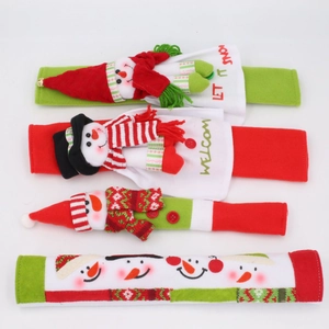 Detail view of 4-piece Christmas fridge handle covers with snowman dolls and festive text