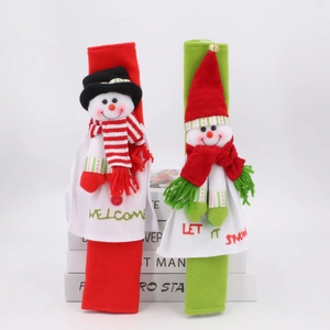 Detail of Santa snowman fridge handle covers in red and green festive plush fabric
