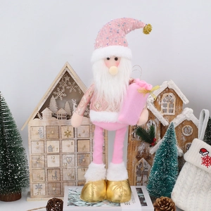 Detailed view of pink and gold Christmas gnome with sequined hat and gift bag accessory