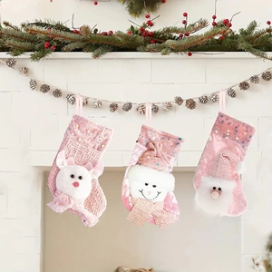 Pink Christmas stockings set with plush 3D snowman reindeer and Santa Claus hanging decor