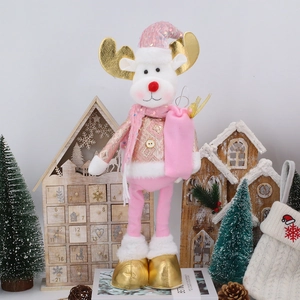 Detailed view of pink and gold Christmas reindeer plush doll with sequin hat and scarf
