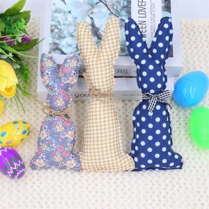 Three plush Easter bunny ornaments with purple floral, yellow plaid, and blue polka dots