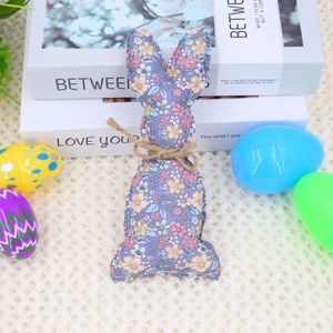 Detail of floral purple fabric Easter bunny ornament with rustic jute twine bow tie