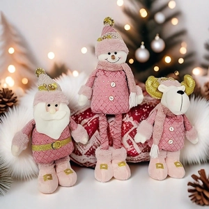 Trio de peluches de Noël roses avec Père Noël, bonhomme de neige et renne festif