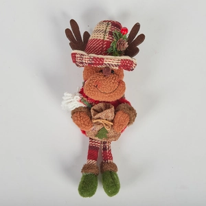 Detail of Christmas reindeer plush doll with tartan hat holding a festive gift bag