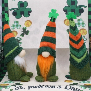 St. Patrick's Day gnome dolls with green hats and clover leaf decorations on a festive background