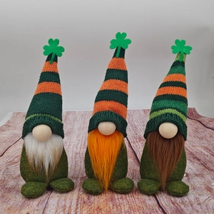 Three St. Patrick's Day gnomes with striped hats and shamrock clover decorations