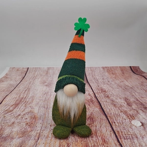 Detail of St. Patrick's Day gnome featuring green striped hat and shamrock decoration