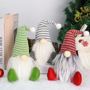 Detail of Christmas gnomes with striped knit hats and long white faux fur beards