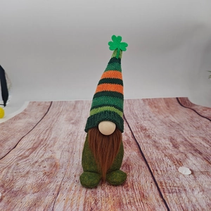 Close-up of St. Patrick's Day gnome with green striped hat and clover decoration