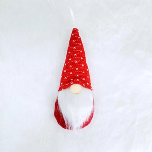 Detailed view of handmade Christmas gnome ornament with red knitted hat and plush white beard
