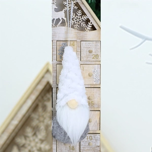 Close-up of a plush white Christmas gnome pendant with long beard and hanging string