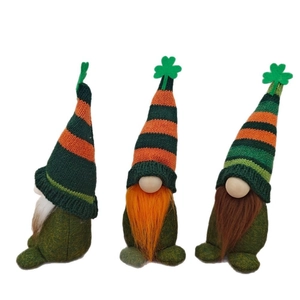 Three St. Patrick's Day gnomes with striped hats and clover details on white background
