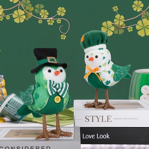 Pair of glowing St. Patrick's Day fabric bird figurines with shamrocks and festive hats